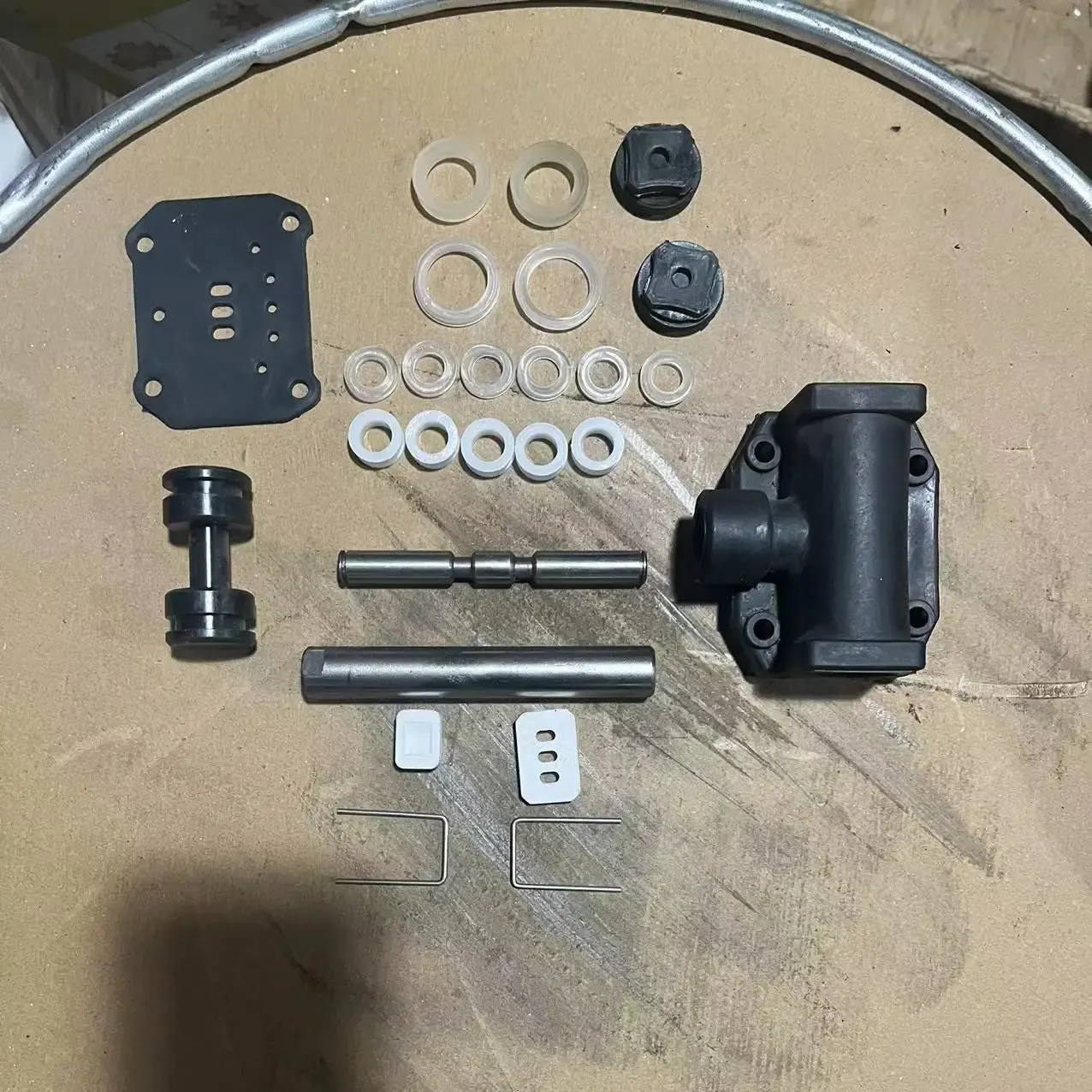 Disassembled diaphragm pump parts laid out for rebuild